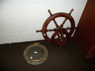 Lot 301 - Two ships wheels and a port hole (3)