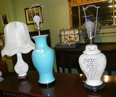 Lot 307 - Two white pottery table lamps and a turquoise ceramic lamp base