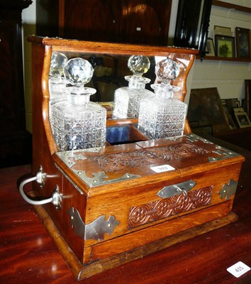 Lot 313 - Victorian oak carved tantalus