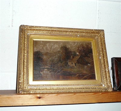 Lot 323 - A provincial oil on canvas of a cottage and bridge in a wooded landscape in 19th century gilt frame