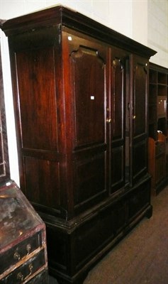 Lot 370 - George III oak livery cupboard