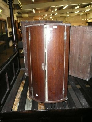 Lot 379 - Georgian bow fronted oak hanging corner cupboard