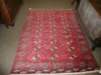 Lot 406 - An Eastern red ground rug