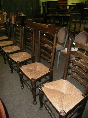 Lot 418 - Set of six oak ladder back and rush seated chairs