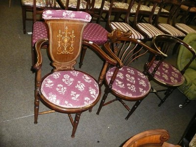 Lot 426 - Three Edwardian inlaid mahogany elbow chairs