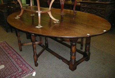 Lot 443 - A Bryn Hall large oak drop leaf dining table (Bryn Hall is based in Wales)