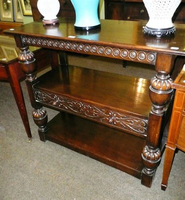 Lot 480 - Carved oak three tier side table with single drawer