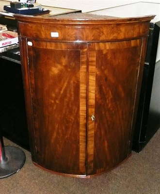 Lot 498 - George III mahogany hanging corner cabinet