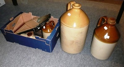 Lot 58 - Stoneware flagons, hot water bottles, two flat irons and a mirror