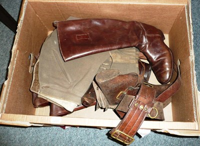 Lot 64 - Two pairs of brown leather boots, brown leather belt, two leather gun holsters, a pair of jodhpurs