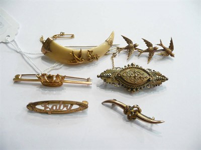 Lot 79 - Six assorted Victorian bar brooches - a 15ct gold bar brooch, a 9ct gold floral motif brooch...