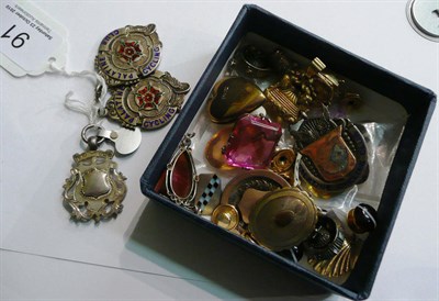 Lot 91 - Five silver medals/shields, assorted charms, pendants, cufflinks, loose gemstones etc