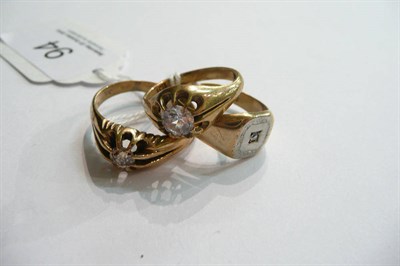 Lot 94 - Two 9ct gold rings and a diamond set ring stamped '9CT' (3)