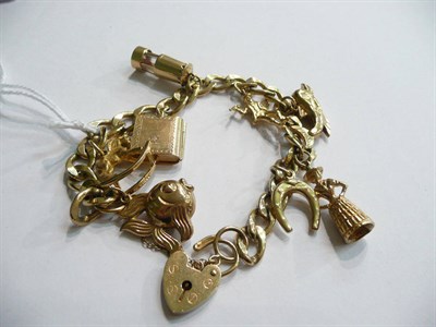Lot 104 - Gold bracelet and charms