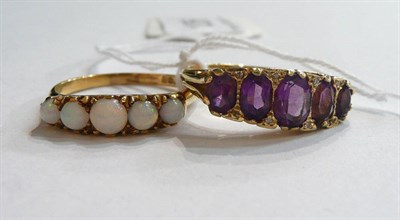 Lot 126 - An 18ct gold amethyst five stone ring with diamond accents and an 18ct gold opal five stone ring