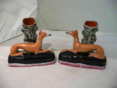 Lot 132 - A pair of Staffordshire greyhound inkwells (2)