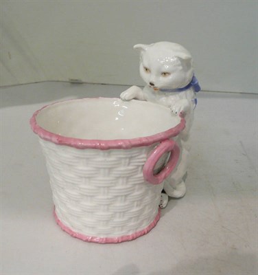 Lot 142 - A 19th century plant pot with a cat
