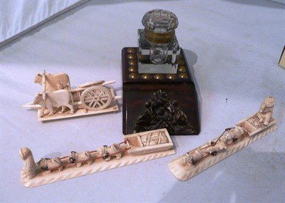 Lot 148 - An inkwell, two Inuit bone carvings and a Burmese ivory carving of an ox cart