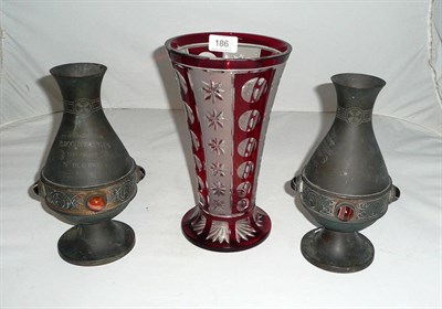 Lot 186 - Ruby overlay glass vase and a pair of funerary vases 1905