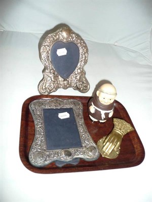 Lot 5 - Two silver photograph frames, a brass 'hand' letter clip, a Goebels 'Monk' jar and cover