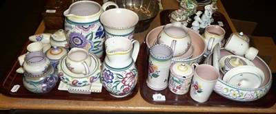 Lot 22 - Assorted Poole pottery jugs, bowls, jars and covers, cruet set etc on two trays