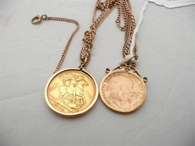 Lot 58 - 1966 sovereign mounted on chain and a 1909 half sovereign mounted on chain (2)