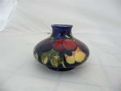 Lot 91 - A William Moorcroft 'Wisteria' pattern squat vase