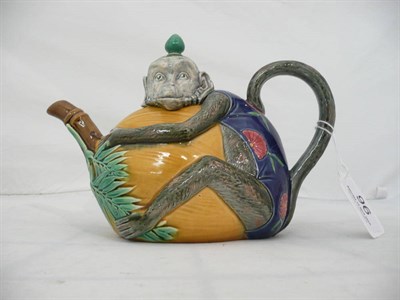 Lot 96 - A Minton Majolica teapot modelled as a monkey around a coconut tree (a.f.)