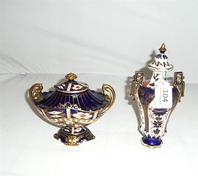 Lot 104 - Two Royal Crown Derby vases and covers