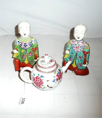 Lot 106 - Qianlong famille rose teapot and two famille rose figures