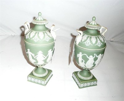 Lot 107 - Pair of Wedgwood green jasperware pale green twin-handled pedestal vases and covers