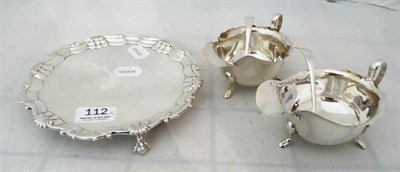 Lot 112 - Silver circular card tray, pair of silver sauce boats and spoons