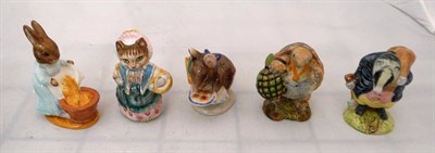 Lot 119 - Three Beatrix Potter figures (gold stamp) and two others (brown)