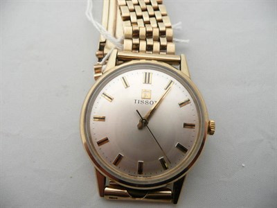 Lot 171 - A Tissot 9 carat gold watch and strap