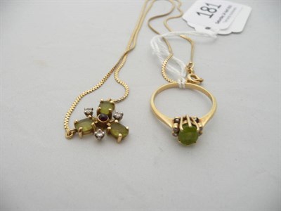 Lot 181 - An 18 carat gold peridot and diamond ring and an 18 carat gold peridot, ruby and diamond pendant