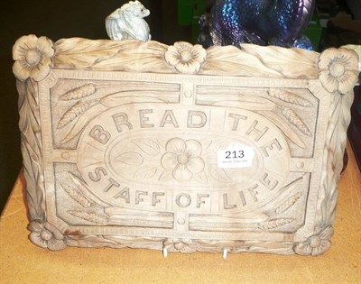 Lot 213 - A Victorian well carved bread board 'Bread the Staff of Life'