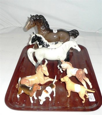 Lot 217 - Three Beswick horses, three hounds and two Sylvac horses