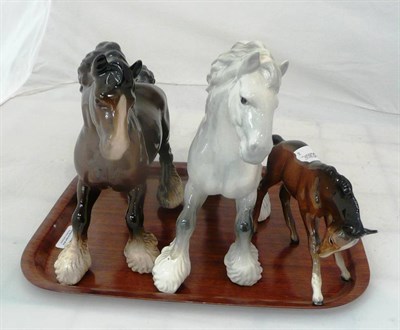 Lot 223 - Two Beswick shire horses and a foal