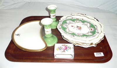 Lot 228 - Two Rockingham plates and another, painted and a pair of Continental candlesticks and a match...