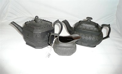 Lot 237 - An early 19th century black basalt teapot and cover and milk jug, and an Adams style teapot and...