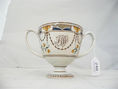 Lot 248 - A Swinton pearlware pottery loving cup, circa 1790, painted with a rim band of yellow...