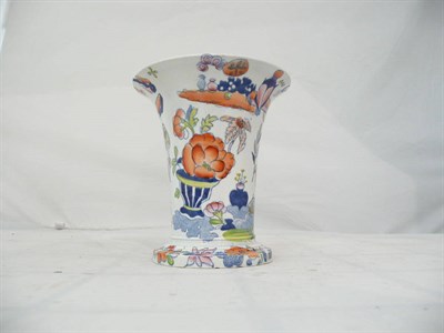 Lot 251 - A Brameld transfer printed earthenware trumpet vase, Rose Jar Pattern, circa 1825-35, on a circular