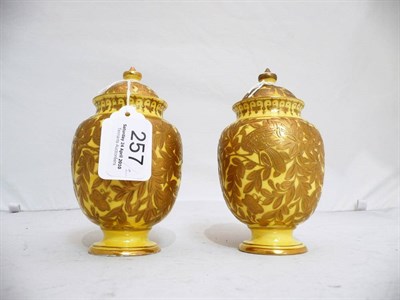 Lot 257 - Pair of Royal Crown Derby yellow and gilt vases 1887, one cover repaired