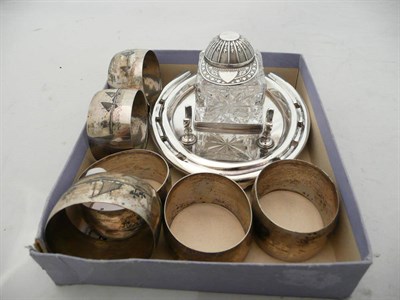 Lot 274 - Silver plate horseshoe inkwell with jockey cap top and six Easter Niello napkin rings