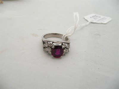 Lot 275 - An 18 carat white gold, ruby and diamond ring