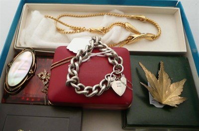 Lot 300 - A silver curb and lock bracelet, three wristwatches, a gold plated leaf brooch, a marcasite ring, a