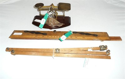 Lot 346 - A French pantograph with instructions, seaman's parallel rule and a postal scale with weights (3)