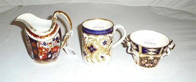 Lot 368 - First Period Worcester mug, Derby-style ribbon-handled cup and a similarly-decorated cream jug