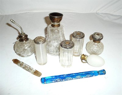 Lot 376 - A collection of three silver-topped toilet jars, three perfume bottles, an atomiser and two...