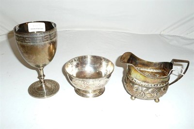 Lot 377 - A Georgian silver bowl, a Georgian silver cream jug and a Victorian silver trophy cup